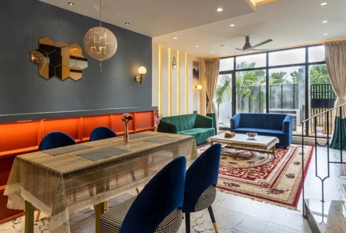 Dining and living area with velvet sofas